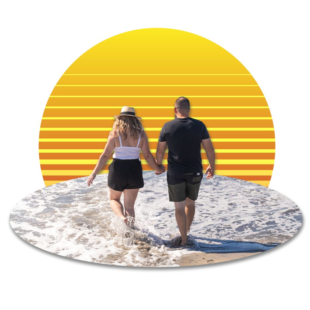 couple walking in the water holding hands